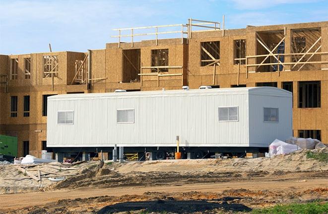 construction workers discussing plans in a rental office in Delano, CA